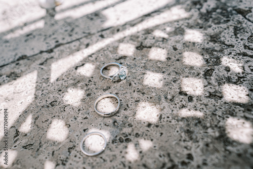 Photography Three Silver Rings on Textured Stone Surface in Toronto