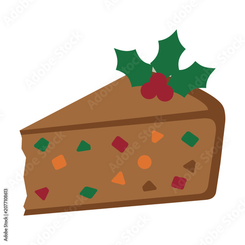 Slice of traditional fruitcake with geometric candied fruit and holly leaves isolated on white background festive holiday food concept