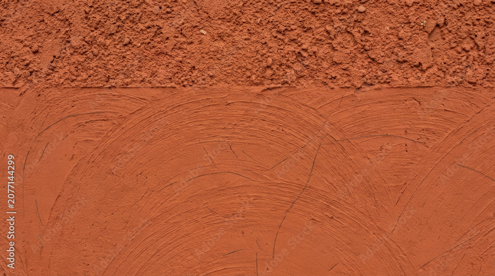 Fototapeta premium Plaster wall texture limewash surface detail with rustic pattern and warm clay color effect for backdrop design. Grunge paint rough material. old surface cement background, architecture plaster