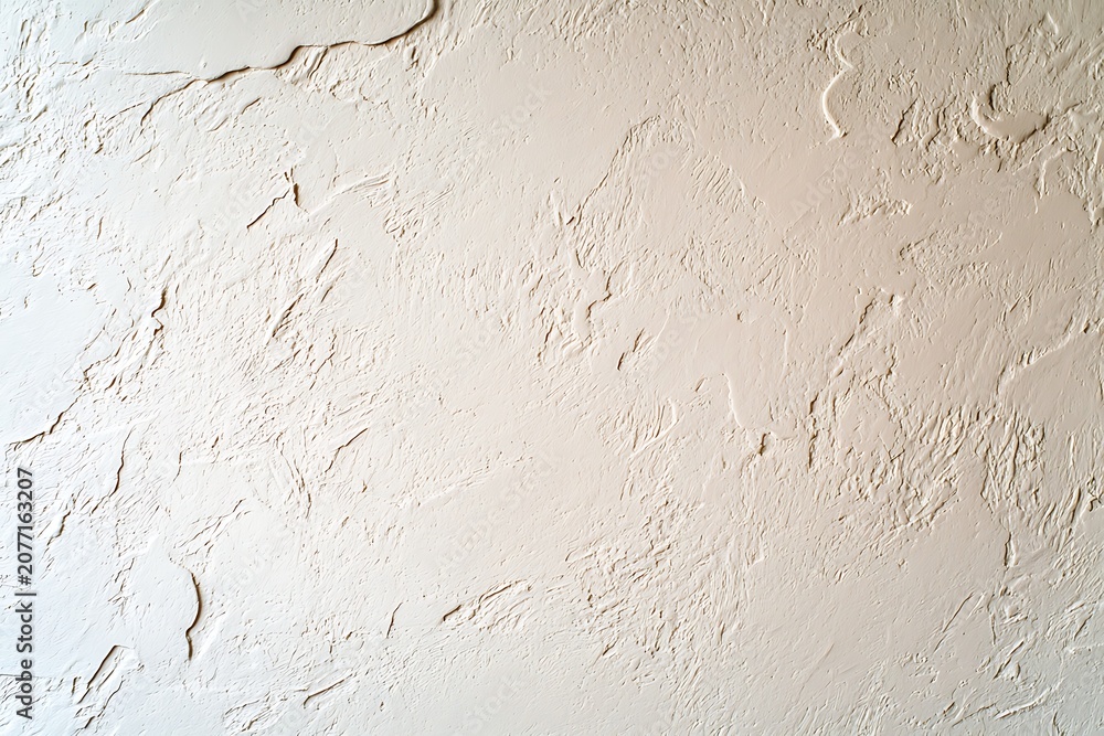 Fototapeta premium Light beige textured plaster wall background with rough surface and subtle cracks for design or architectural use