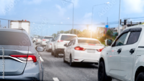 Фотография Wide perspective of modern white and grey sedans gridlocked in a heavy urban traffic jam