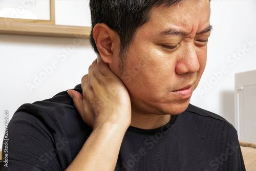 Tableau sur toile Person suffering neck and occipital strain indoors, promoting healthcare treatment, physiotherapy, and wellness recovery