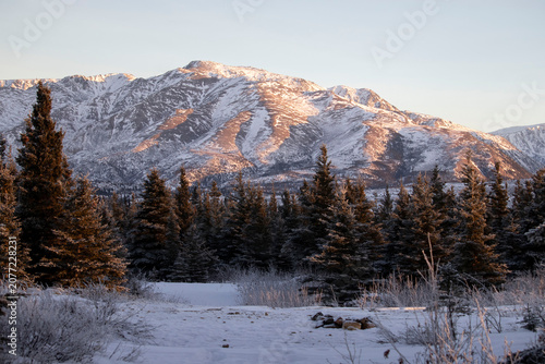 Sun shining on mountain in Alaska.