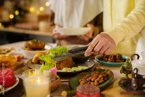 Asian Muslim family preparing healthy dinner for Ramadan Iftar