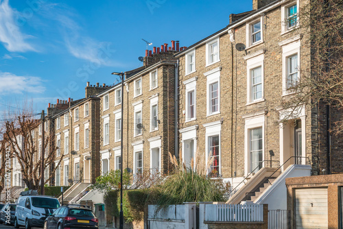 A row of traditional Georgian terraced houses in Camden, London, UK