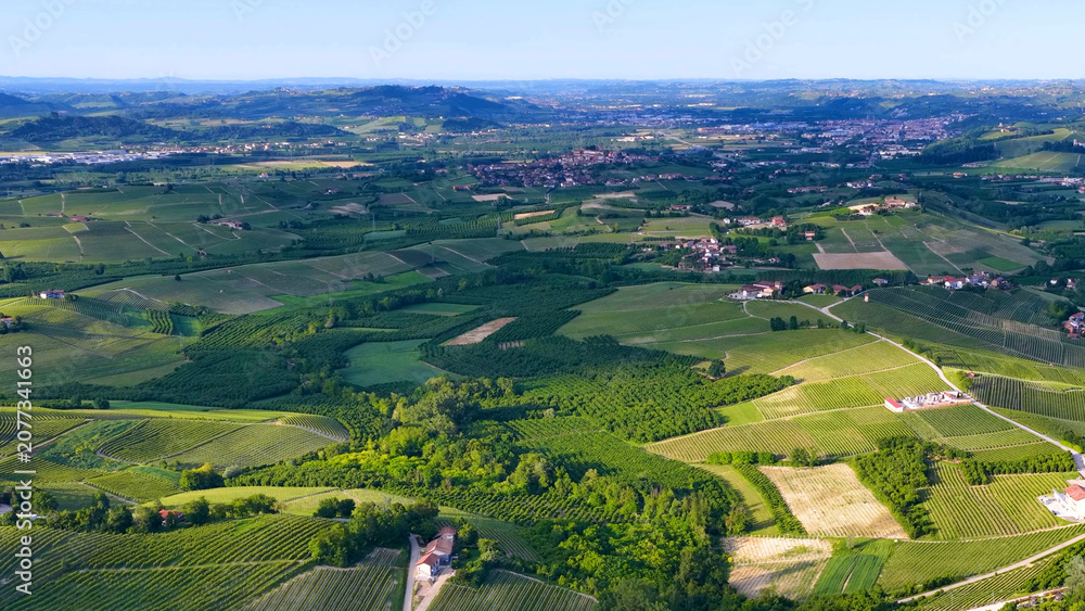 Fototapeta premium Aerial View of Rolling Green Vineyards and Hills in Piedmont Italy