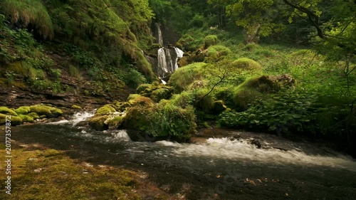 Small waterfall in mountain valley