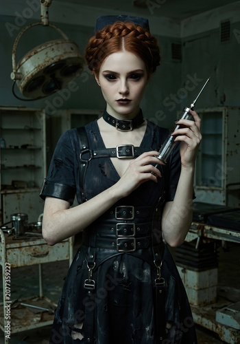Beautiful woman cosplay as evil nurse in abandoned hospital