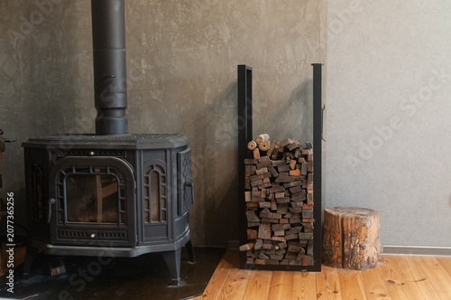 Black Cast Iron Wood Burning Stove and Log Holder