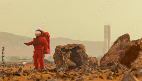Astronaut exploring rocky Mars landscape with futuristic base