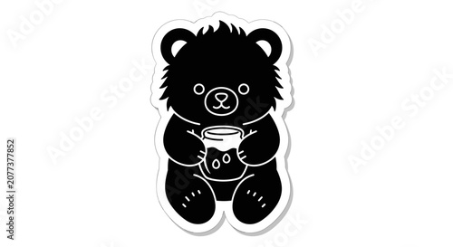 Black bear holding a jar.