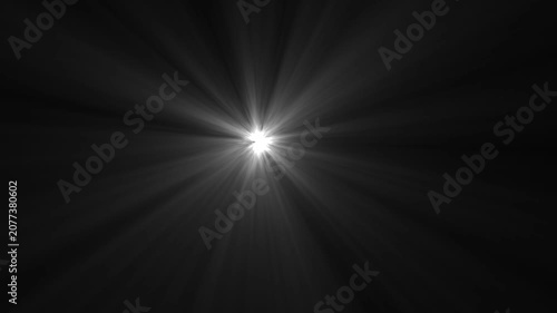 Bright Light Burst with Radial Rays on Black Background