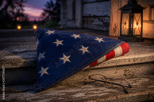 Brilliant fireworks and waving American flags with luminous color harmony on blue night sky