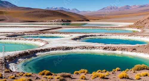 Serene turquoise lake surrounded by rocky cliffs and mountains.