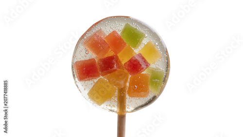 Fotografía Clear lollipop with colorful fruit jelly cubes inside