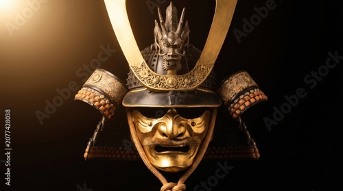 Traditional Japanese Samurai Kabuto Helmet with Golden Mask and Dragon Crest on Black Background