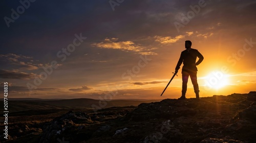 Silhouette of a Brave Samurai Warrior Standing on a Hill at Sunset with Sword