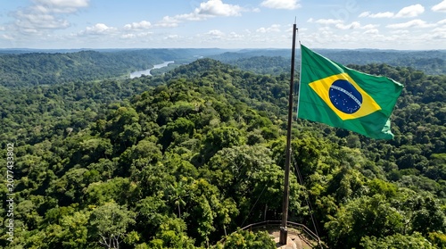 Brazilian flag waving over the Amazon rainforest landscape aerial view