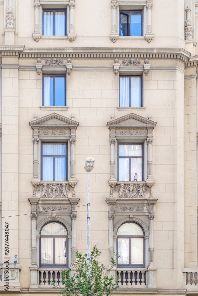 Fototapeta premium Barcelona, Building Facade, Historic Eixample District, Neo Classical Architecture, Sculpted Reliefs