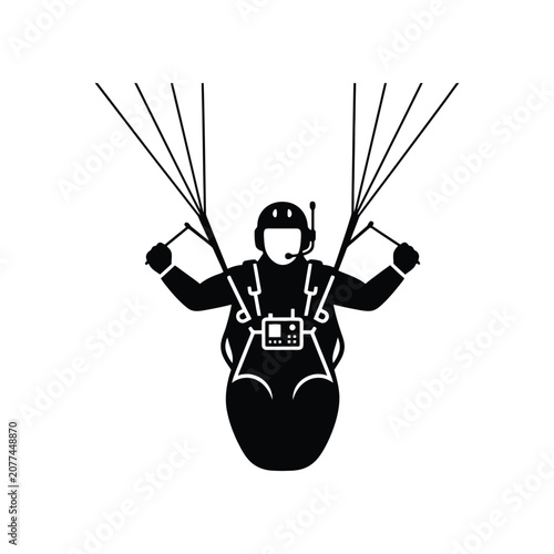Paraglider in flight with harness and helmet during outdoor adventure with clear sky concept