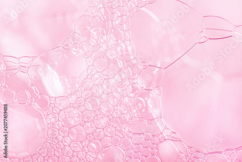 Macro pink soap bubbles texture background with copy space.