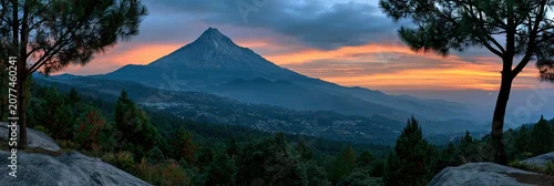 Panel kuchenny z motywem Mountain peak at sunrise with forested foothills and misty valleys for panoramic landscape wallpaper and atmospheric background
