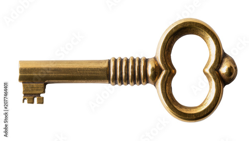 Foto Antique brass skeleton key with ornate bow and ribbed shaft
