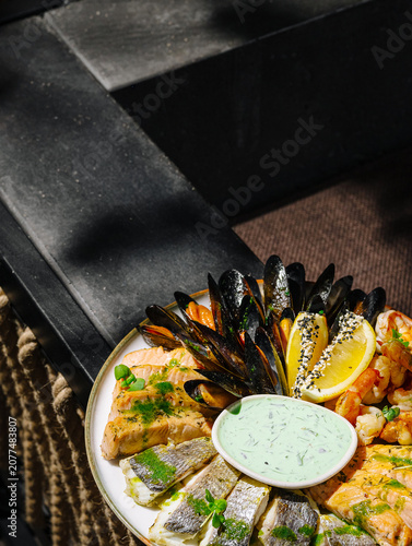 Seafood platter with mussels, salmon, and white fish