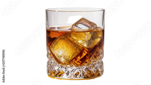 Amber whiskey in faceted glass with ice cubes