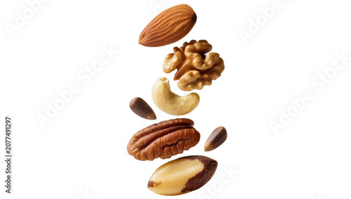 Quadro su tela Assorted nuts and seeds falling almond walnut cashew pecan brazil nut, pine nut