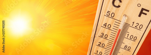 Thermometer showing extreme high temperature on a hot sunny day