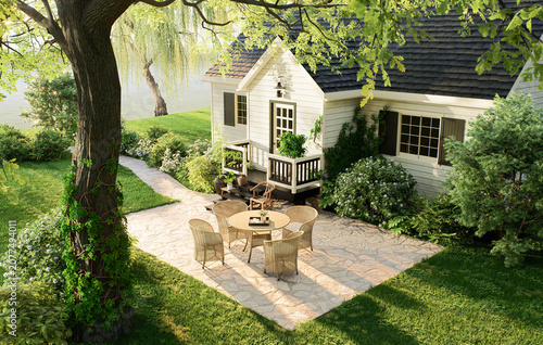 Cozy cottage patio with wicker furniture near a lake in the garden