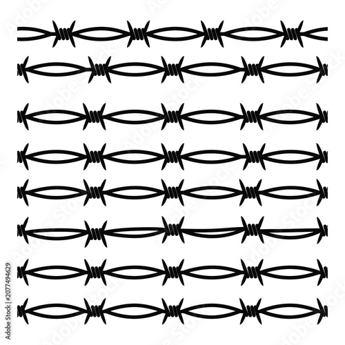 Konstfotografi Barbed wire fence lines with sharp metal spikes and coils  security and protecti