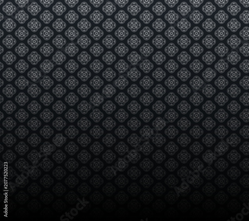 A dark room with a patterned floor and a gradient effect transition