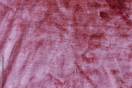 Luxury dusty rose crushed velvet fabric texture with soft plush pile and elegant textile background