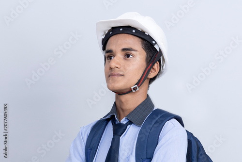 Fényképezés A student, youth boy dreaming to become engineer, architect aiming high to fulfill his career seeing possibilities , educational institutions coaching for better studies and results