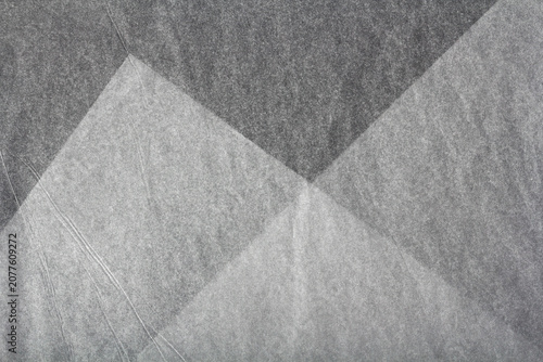Vászonkép sheets of thin translucent tissue paper on a black background