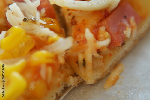 Savory freshly cooked traditional pizza topped with cheese and golden corn.