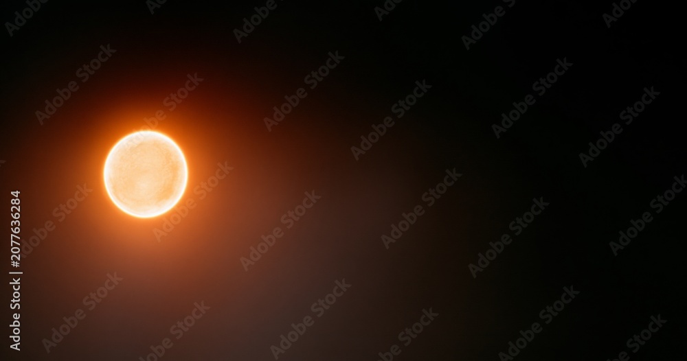Obraz premium Glowing orange celestial body in space
