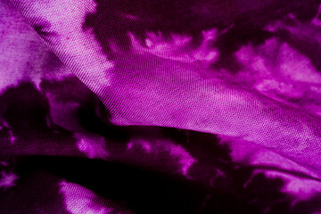 Close up of purple tie dye fabric texture