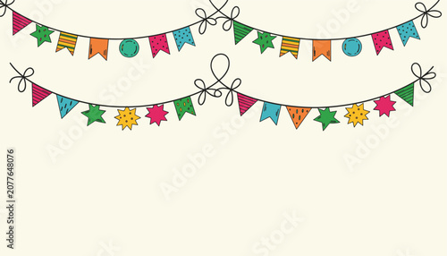 Festive colorful bunting flags hanging on two thin black strings for a party celebration on a warm off-white background.
