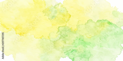 Abstract watercolor splashes of yellow and green evoke a sense of fresh spring bloom and natural beauty.