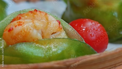 4K A close-up video of a beautifully presented dish being served in a traditional Chinese restaurant