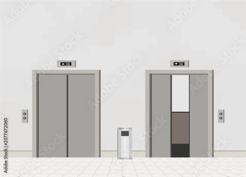 Two minimalist, grey elevators side by side against a white wall, one completely closed and the other partially open showing a dark interior, with a small trash can standing between them.