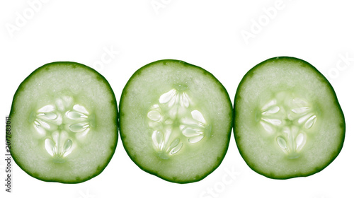 Fotografía Three fresh cucumber slices with visible seeds and green skin