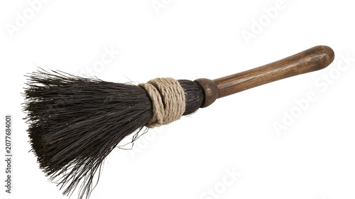 Cuadro en lienzo Rustic wooden broom with coarse bristles and twine binding