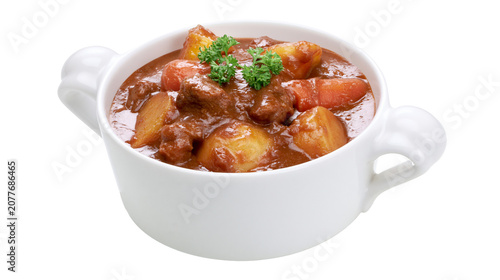 Tableau sur toile Hearty beef stew with potatoes and carrots in white bowl