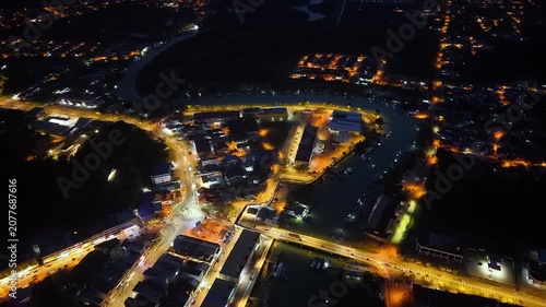 Night aerial view captures vibrant city lights