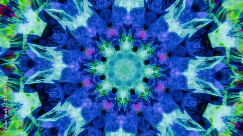 Rotating central kaleidoscopic mandala pulsing, reconfiguring onscreen on loop start for projection