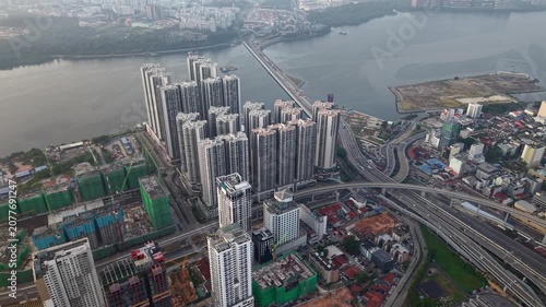 Tall residential buildings line the riverbank